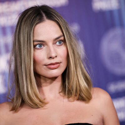 Margot Robbie with a long straight lob hairstyle