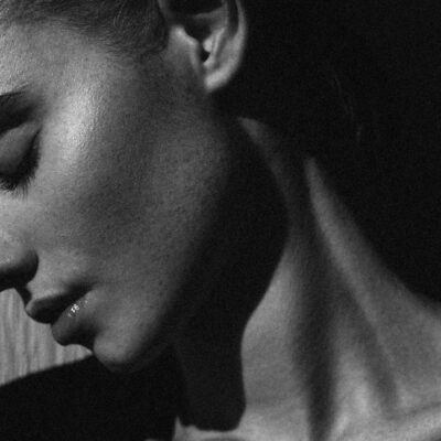 black and white portrait of woman side profile and jawline