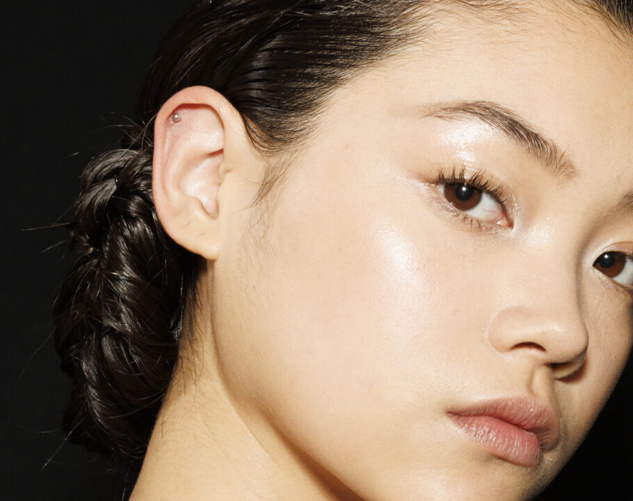 Up-close of Asian woman's face on a black background