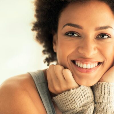 Captivating portrait of a smiling woman with a warm and friendly expression.