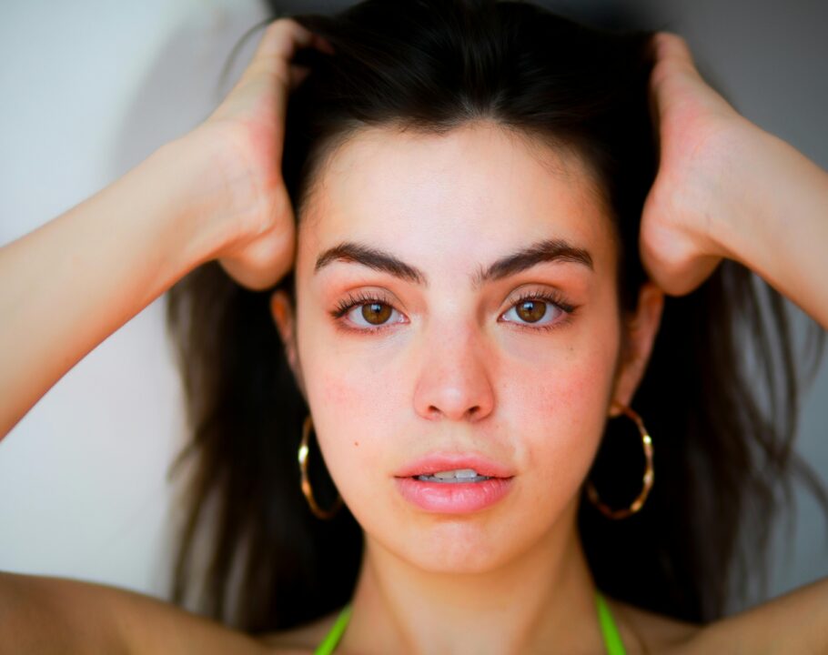 Close-up portrait of a woman with natural beauty, shot in soft natural light.